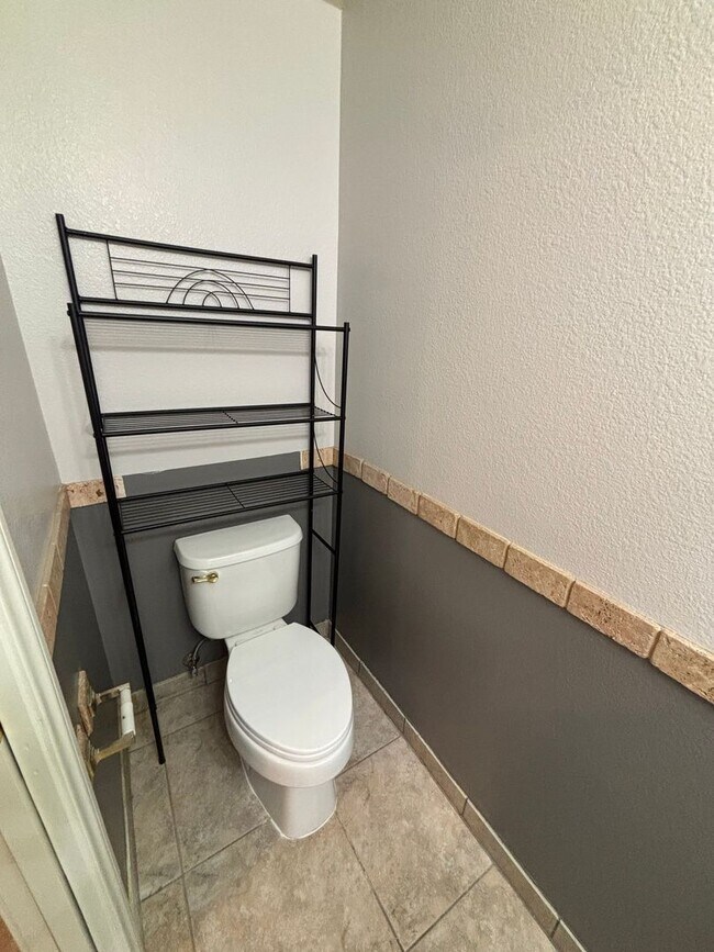 Building Photo - Gated Green Valley Ranch Townhome | 2 Bed | 2.5 Bath | 2-Car Garage