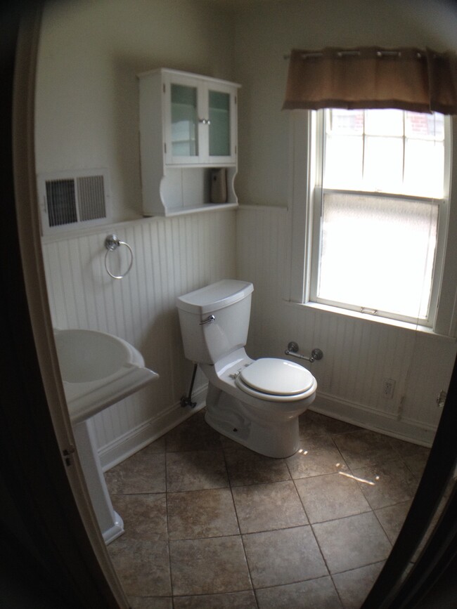 Full bath upstairs with pedestal sink. - 3239 Wendover