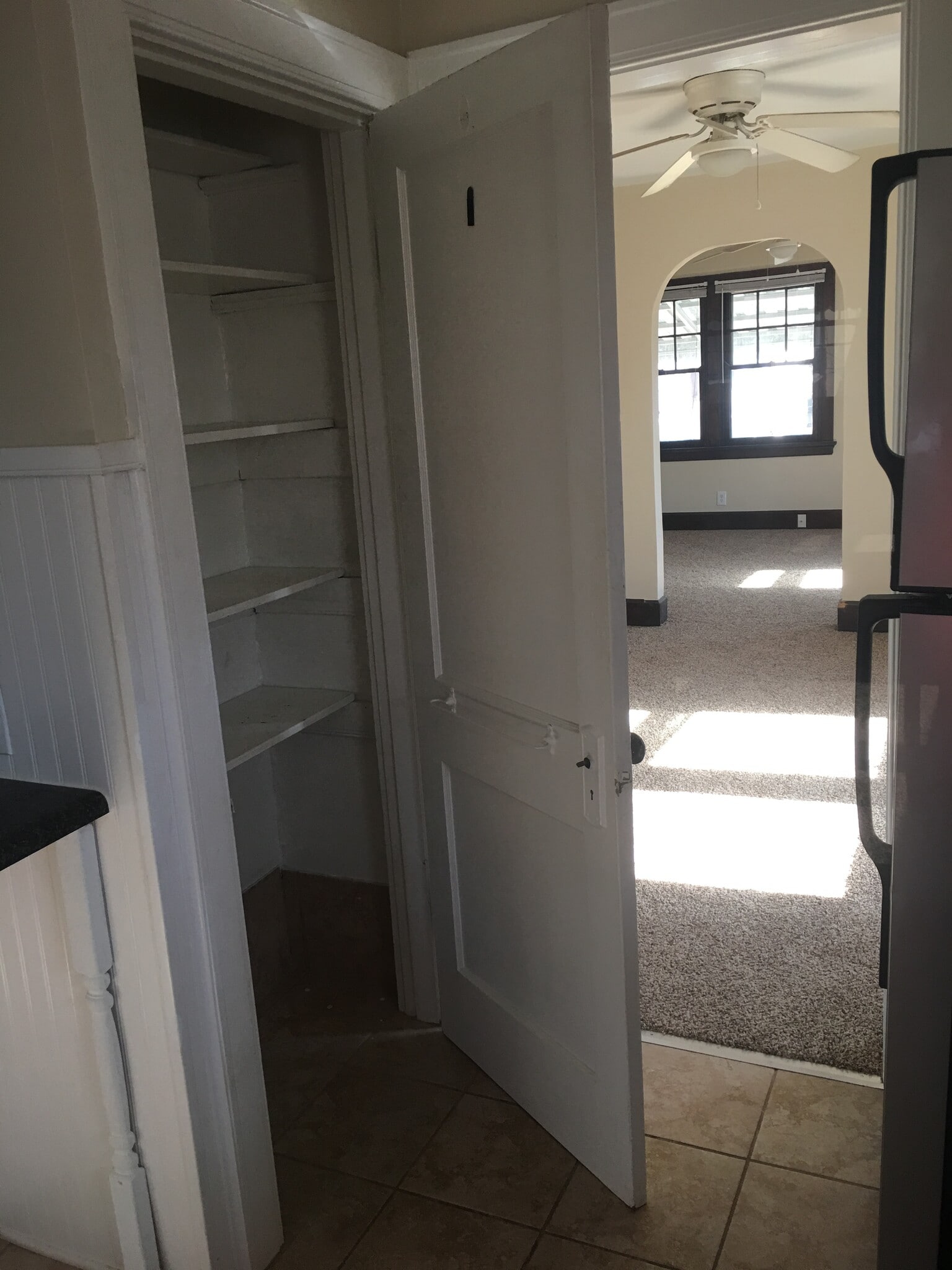 Kitchen pantry and view into living and dining room - 4115 34th Avenue