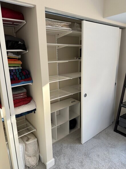 closet and linen closet in second bedroom - 7500 Woodmont Ave