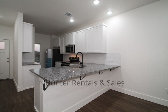 Building Photo - Upscale Four-Bedroom Townhome!