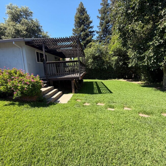 Building Photo - Adorable house with large deck,  yard and RV access