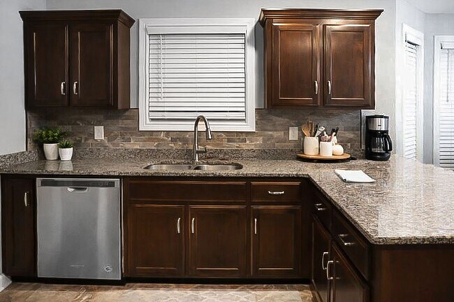 Building Photo - Pet Friendly Three Bedroom with Bonus!