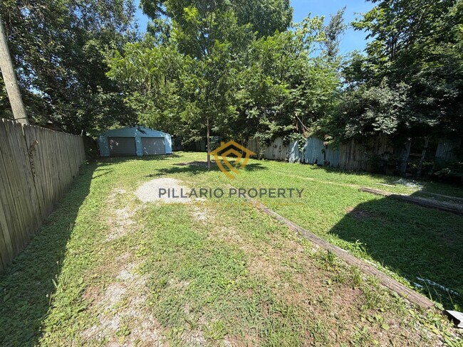 Building Photo - Charming 3-Bedroom Stone Bungalow with 2-Car Detached Garage & Fenced Yard, Available NOW!