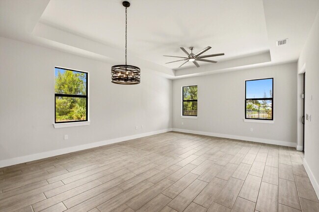 Building Photo - Brand New Canal-Front Pool Home for Rent, 3/2/2, NE Cape Coral. The Builder Didn't Cut Corners, S...