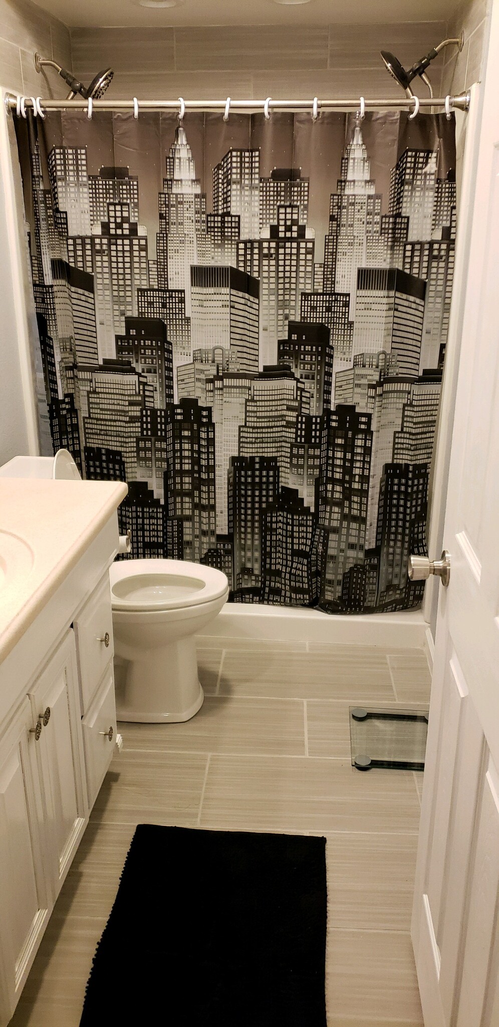 Freshly remodeled bathroom with two showerheads. - 3916 Bluebell Dr.