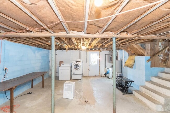 washer and dryer in the house, with access to the backyard and carport via outside stairway - 1105 Golfview Dr