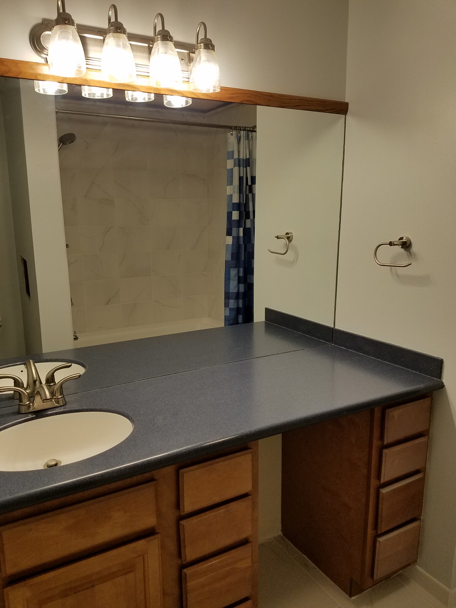Clean updated bathroom with large vanity &amp; tiled shower! - 1901 Bodwell Rd