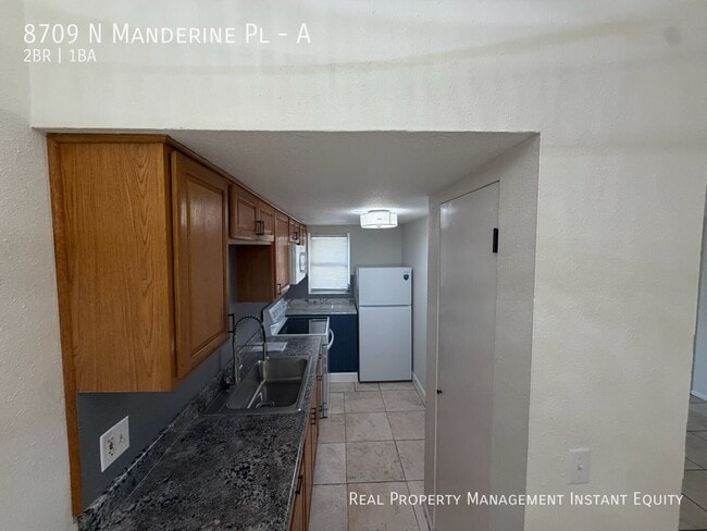 Building Photo - 8709 N Mandarine Pl