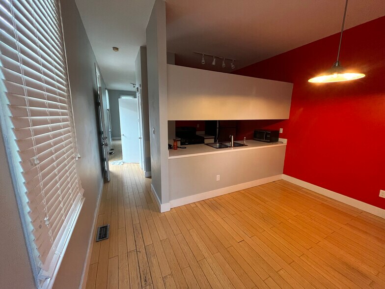 Kitchen unfurnished, connected to living room. - 1626 Carroll St