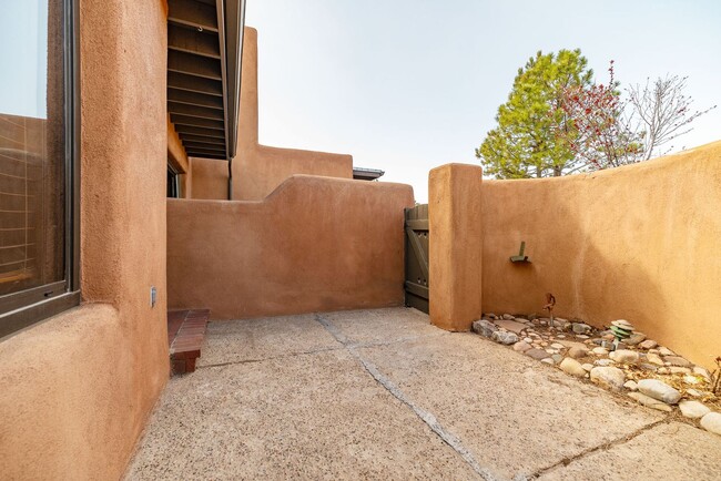 Building Photo - Two Story Condo Just off Old Taos Highway ...