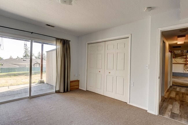 Building Photo - Spacious 2-Story Split-Level Home with Wat...
