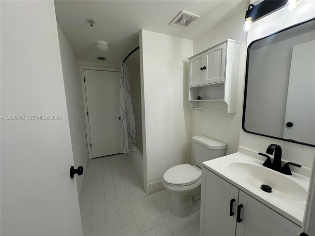 Building Photo - 3241 Sabal Palm Manor