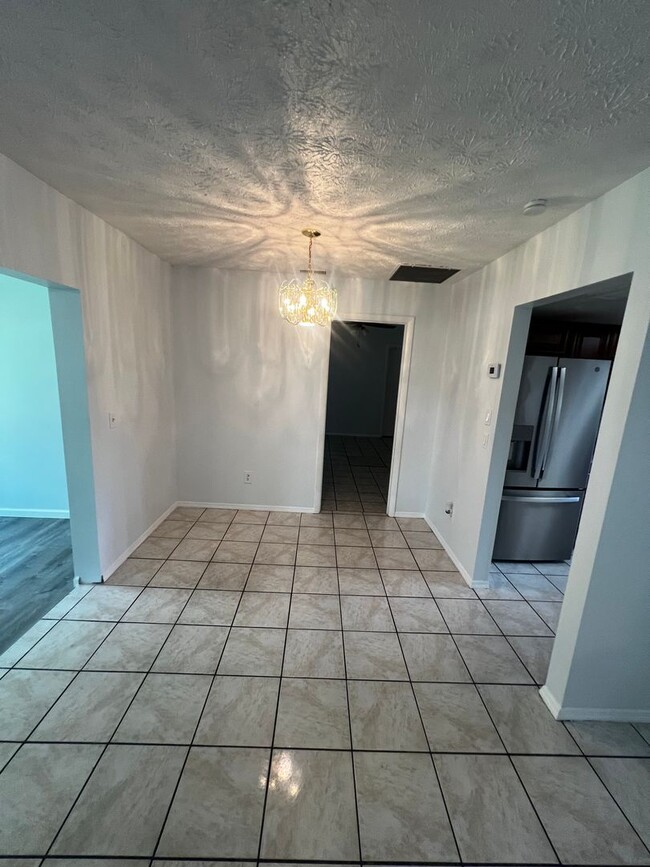 Building Photo - 3 BEDROOM 2 BATH CONVENIENTLY LOCATED WITH A TROPICAL OASIS IN THE BACK YARD!