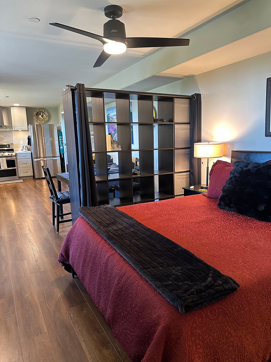 Shelving unit divides space. - 7079 Engineers Rd