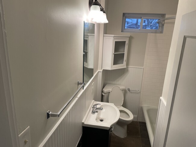 New fixtures and wainscoting in the updated bathroom - 5033 Devonshire Ave