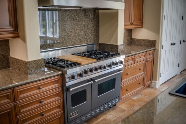 Entertain in this professional chefs kitchen with Sub-Zero and Viking adjacent to the great room. - 2850 Bronzino Ct