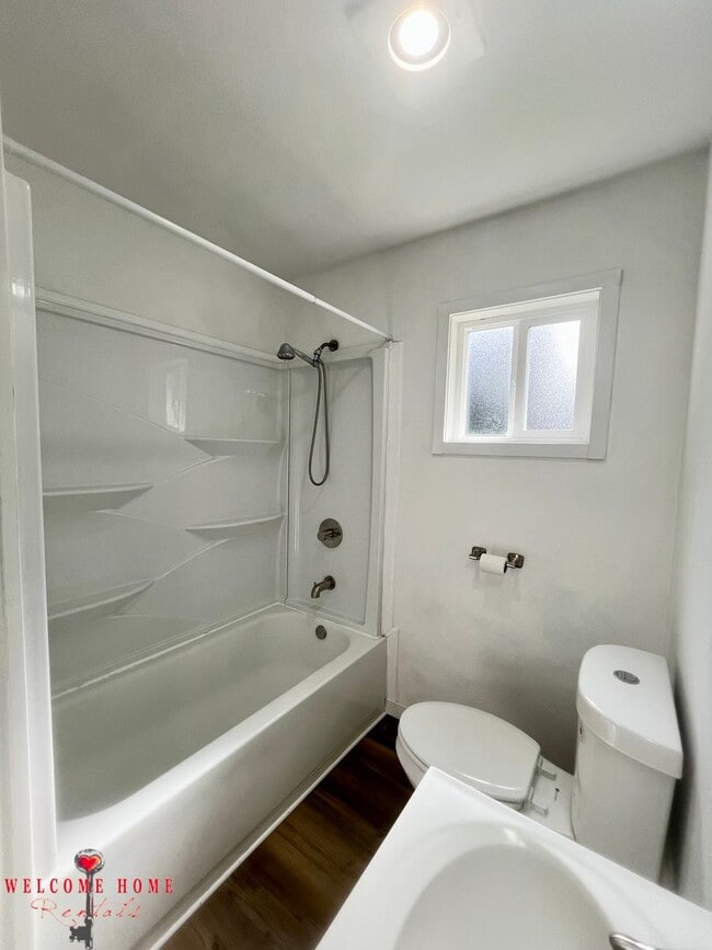 Building Photo - 4 bedroom home with air conditioning - Great location!!!  HUGE basement for your man cave or she ...