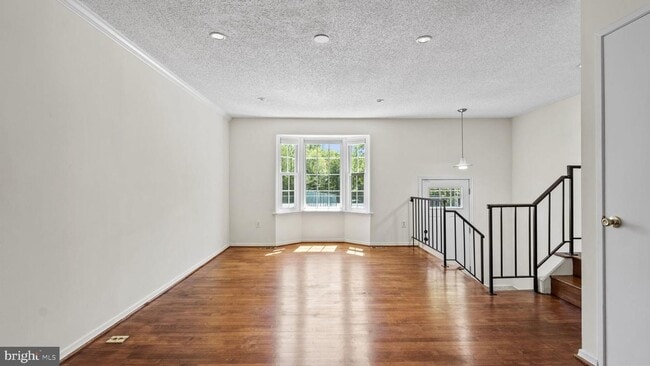 Building Photo - This stunning 3-bedroom, 2-bathroom interior townhome is sure to impress.