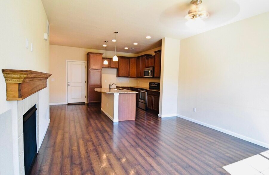 open concept kitchen / attached living room - 5580 W 72nd Ave