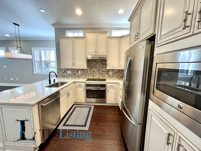 Building Photo - 8144 Tavistock Lakes Blvd
