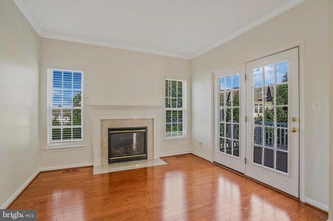 Building Photo - This beautifully maintained brick-front, three-level townhome is located in a highly sought-after...