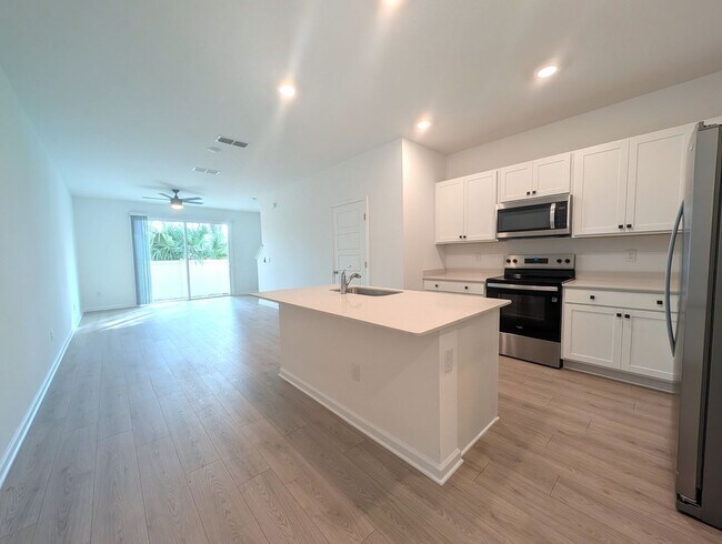 Building Photo - BRAND NEW 3 Bedroom, 2.5 Bath - End Unit - Townhome with Upgrades - located on the Westside - CLO...