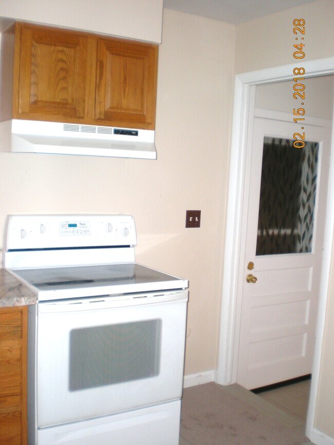 Backdoor from kitchen and stairs to lower level - 1160 Clinton St