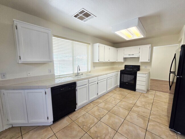 Building Photo - Spacious 4-Bedroom Corner Lot Home with Covered Patio