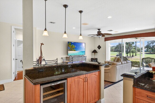 Building Photo - This 2 bedroom plus den, 2 bath condo with a one car garage offers expansive golf course and lake...