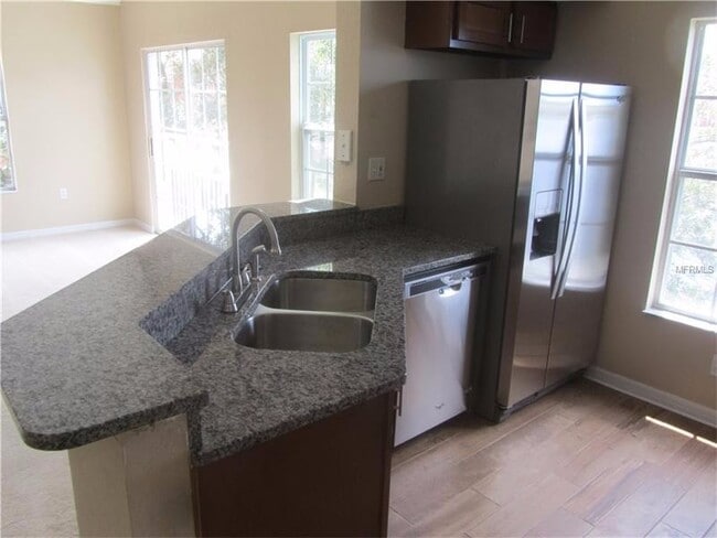 Building Photo - Water view condo with garage in sought after westchase