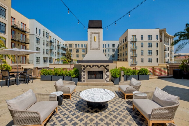 An inviting outdoor fireplace creates the perfect setting for relaxing evenings - Windsor Pasadena