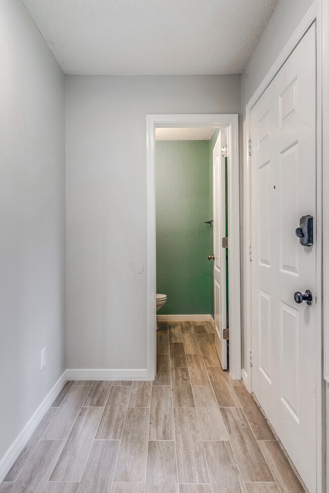 Entry with 1/2 bath to the right - 3260 Cypress Ln