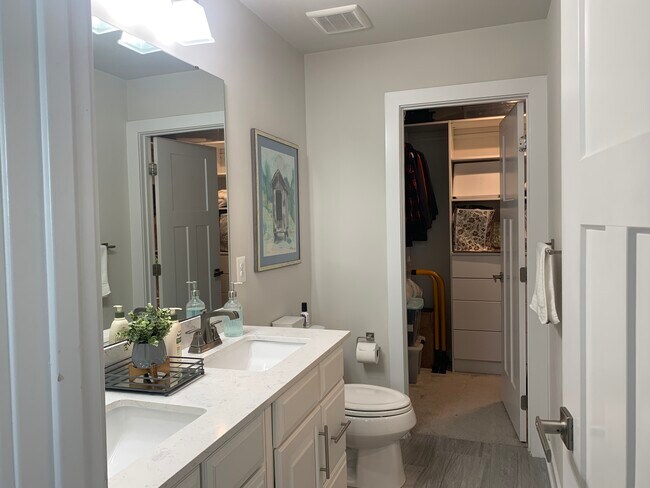 1st Primary Suite bathroom through to walk in closet - 3606 Journal St