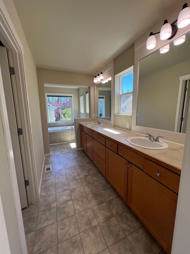 Building Photo - Spacious 4 Bedroom Home with Zen Backyard and 3-Car Garage