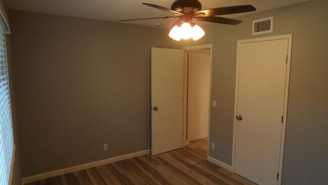 Building Photo - REMODELED 2BR; 1BA end unit condo w/ 1 car garage & 1 parking space