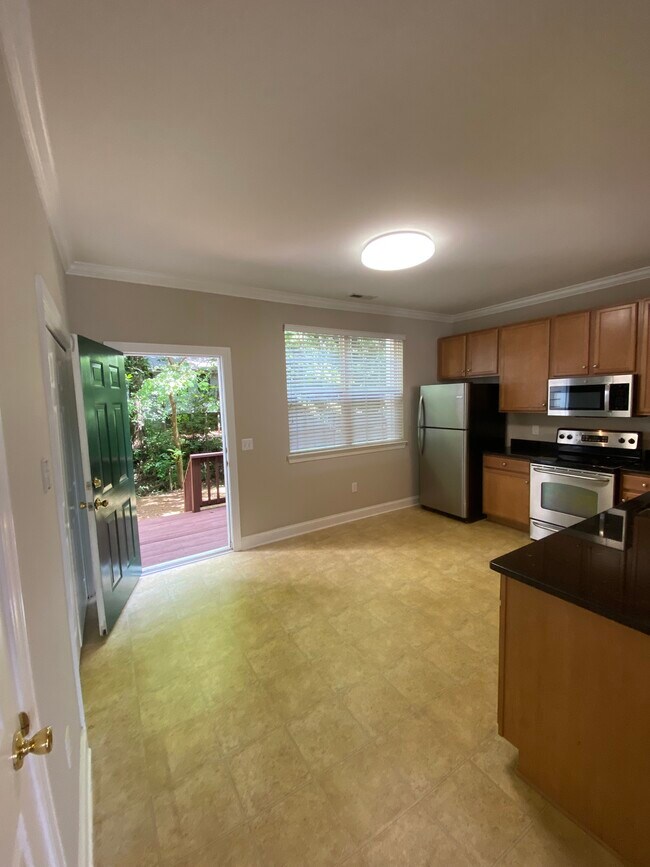 Nice spacious kitchen with plenty of cabinets. Granite countertops. Back porch is great space. - 137 High Ridge Rd