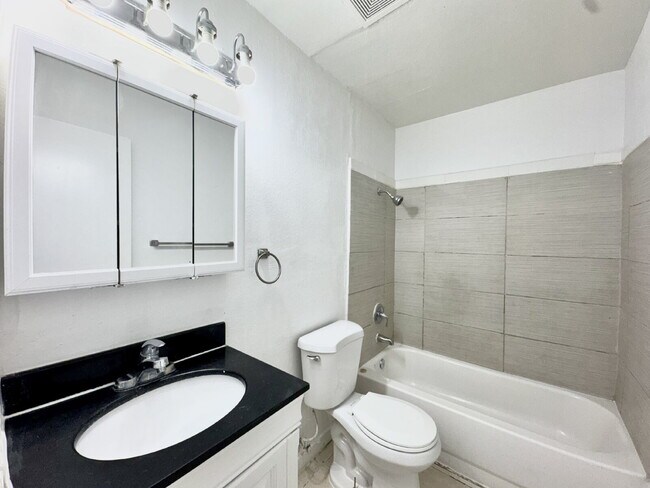 Building Photo - HIVE SUMMER MOVE-IN SPECIAL: DOWNSTAIRS CONDO | RECENLY REHABBED 2 BEDROOM 1 BATH | ACROSS FROM C...