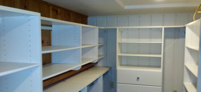 Drawers, shelves and hanging racks place all of clothes at fingertips. - 8261 Northrop Plz SW