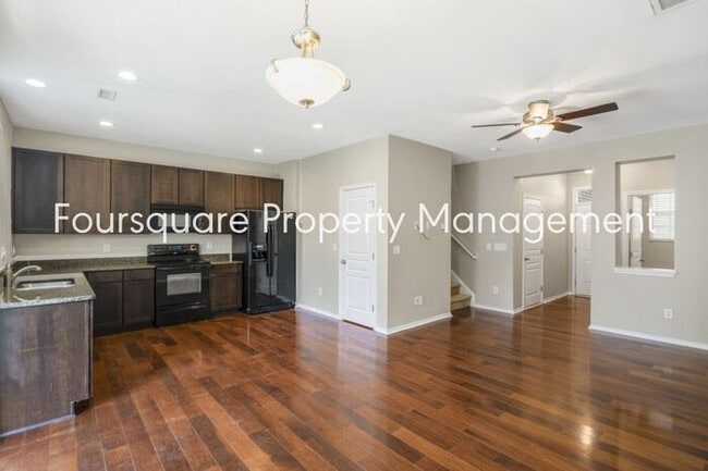 Building Photo - Charming Townhome with Open Layout, Back Patio & One-Car Garage – Near RTP, RDU & Everyday Conven...