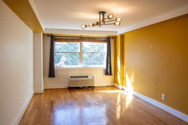 Building Photo - $750 Move-in Credit! Bright and Peaceful One-Bedroom with Built-Ins and Rooftop Views