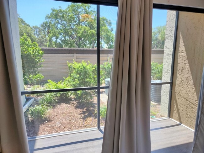 Building Photo - Bird Bay Village Annual Rental – Furnished 1st Floor Unit with Covered Parking