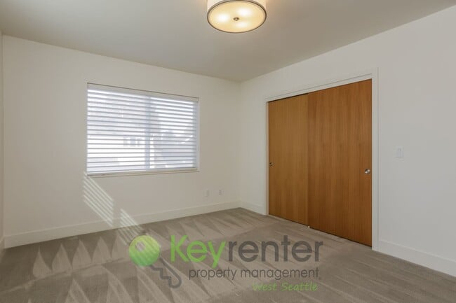 Building Photo - Spacious Living with Balconies, Deck, and Private Yard