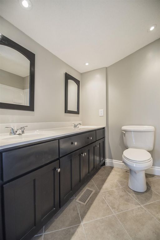 Newly renovated bathroom with tile floors - 725 North Academy Street