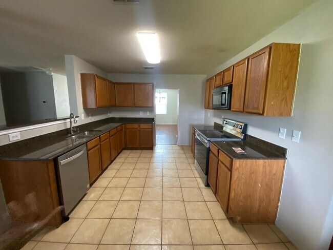 Building Photo - Formal Living and Dining on both sides of ...