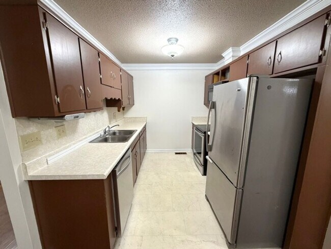 Building Photo - 2 Bedroom 1 Bath Duplex with garage/basement, side porch, and carport.