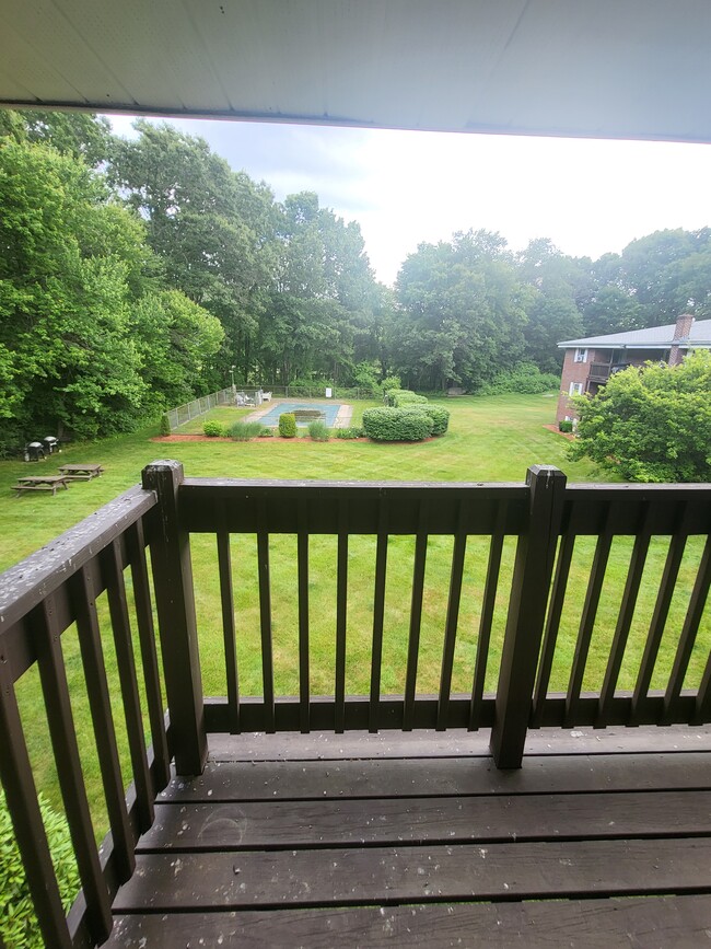 Balcony overlooking Pool, Grounds and Wooded Area - 39 Pleasant St