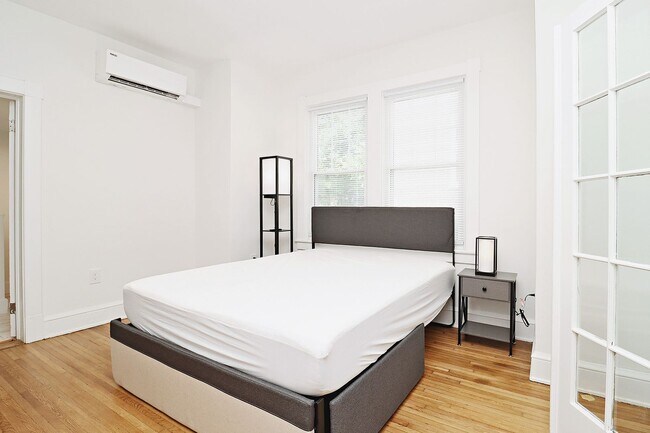 Building Photo - Furnished, Light-Filled Apartment With Utilities Included