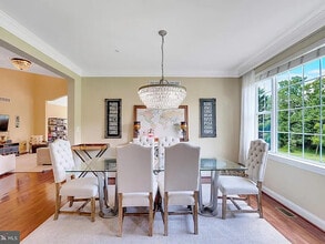 Building Photo - A stunning end-unit carriage home with an ...