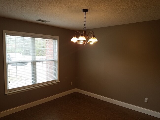 Building Photo - Spacious 3BR Brick Home with Open Split Floor Plan & Tiled Back Porch on Nearly an Acre